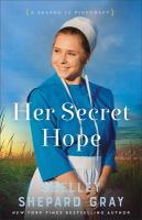 Cover of Her Secret Hope. Young woman in Amish clothing smiling in front of background of sea oats and sky.