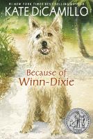 Cover of Because of Winn-Dixie. Painting of a white dog smiling, sitting on a sandy spot with some sea grass behind it.